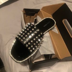 Women’s black and silver sandals.